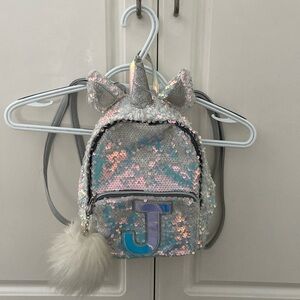 Justice sequined, unicorn backpack with puff ball